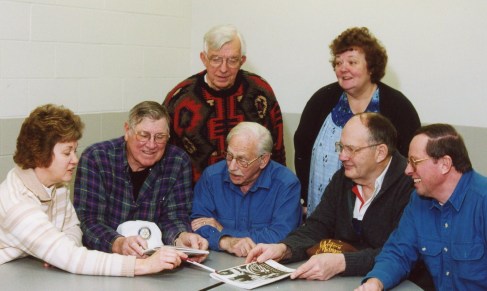 The advertising committee for the Showboat program, worked behind the scenes in relative obscurity, but actually brought in the most money each year. Pictured here from left to right, Gen Landtroop, Richard Coppes, Arle Schneider, Warren Lawrence, Jim Shaw. Standing in back, Charlie Kendall and Jackie Lawrence.