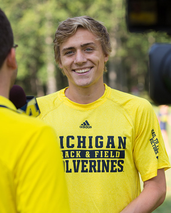 A young man in a yellow jersey.