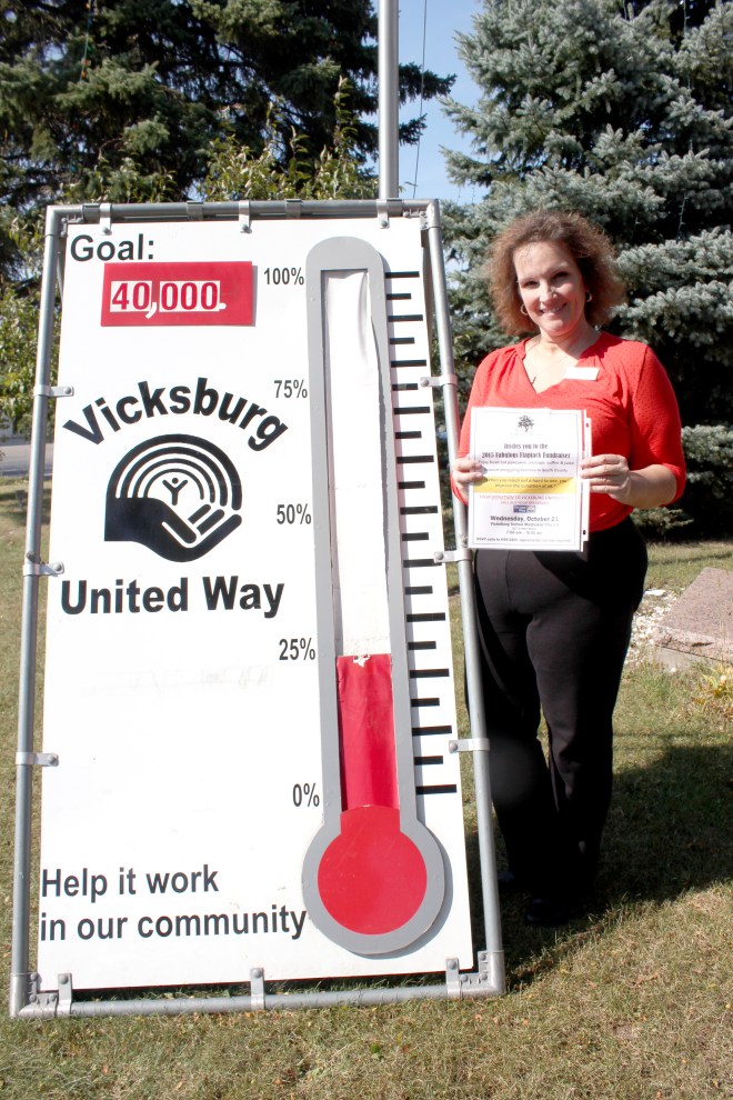 Ann Marie Earl displays the invitation to the 2015 Fabulous Flapjack Fundraiser, which will push the United Way thermometer to a much higher level.