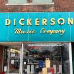A turquoise blue sign reads Dickerson Music Company.