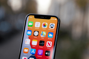 A closeup view of an iPhone with app tiles.