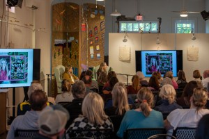 A crowd watches Bonnie Jo Campbell speak about her writing.