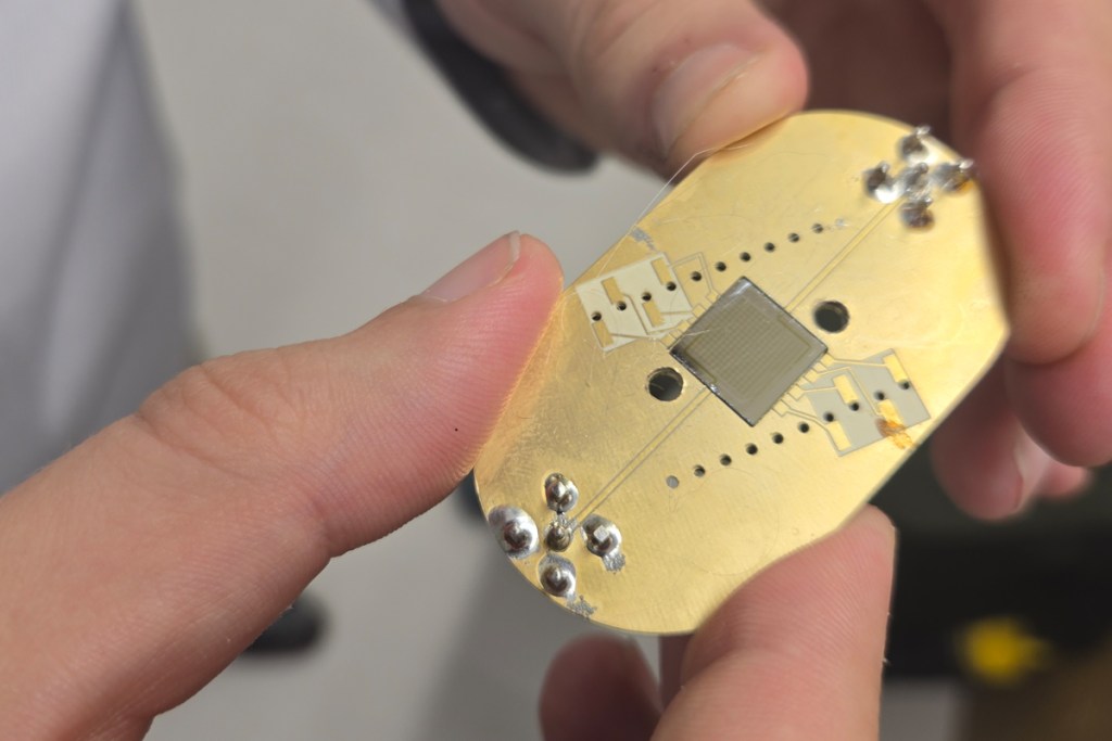 A small computer component that fits in the palm of a hand.