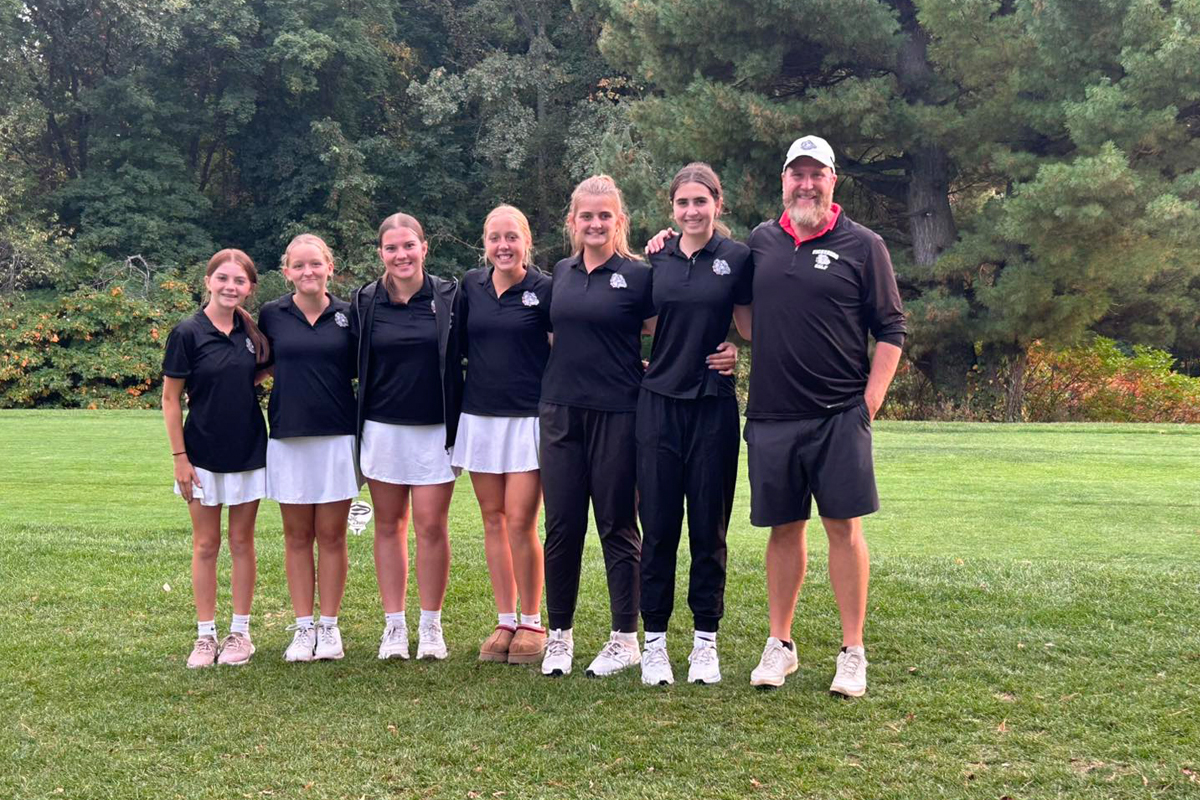 vicksburggolf The golf team stands in a row with matching black uniform shirts.