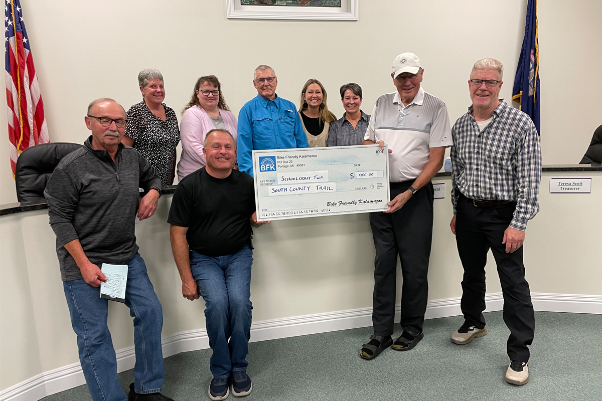 An oversized check is presented to a township council.