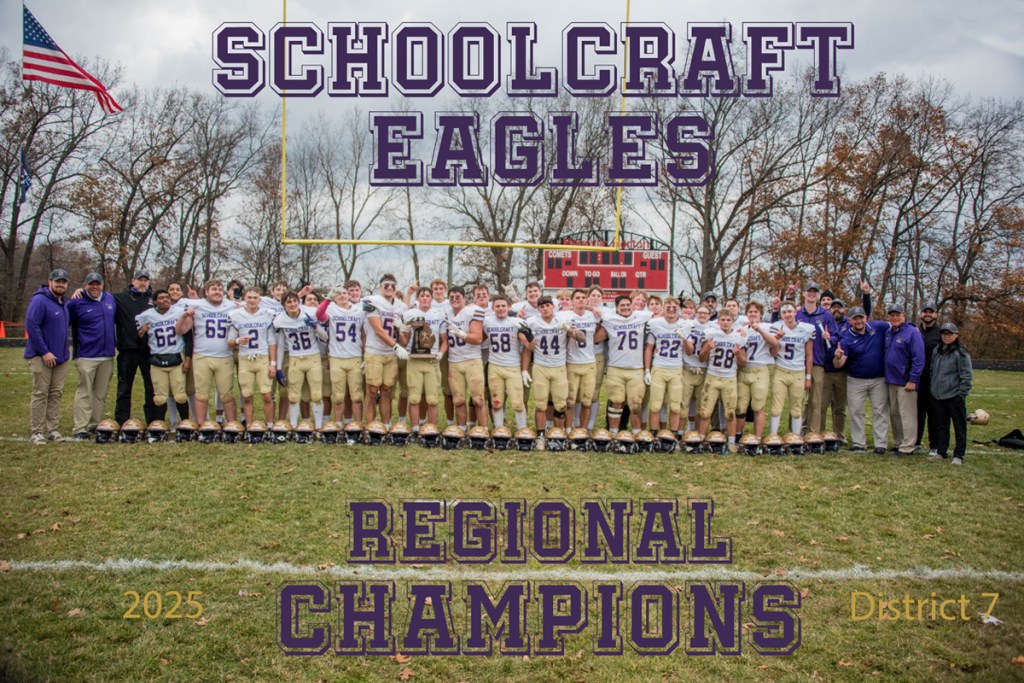 A team photo of football players in purple and white uniforms.