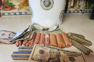 Paper money and rolled up coins.