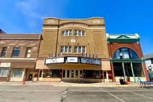 A historic theater building with a marquee that reads "Vista."