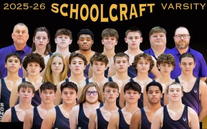 The lineup of wrestlers and coaches.