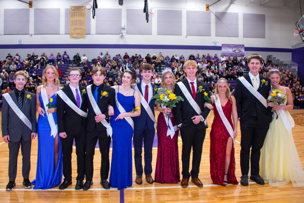 The Schoolcraft homecoming court stands in a line at the center of the gym.