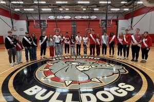 The Vicksburg winter homecoming court stands in the center of the gym.