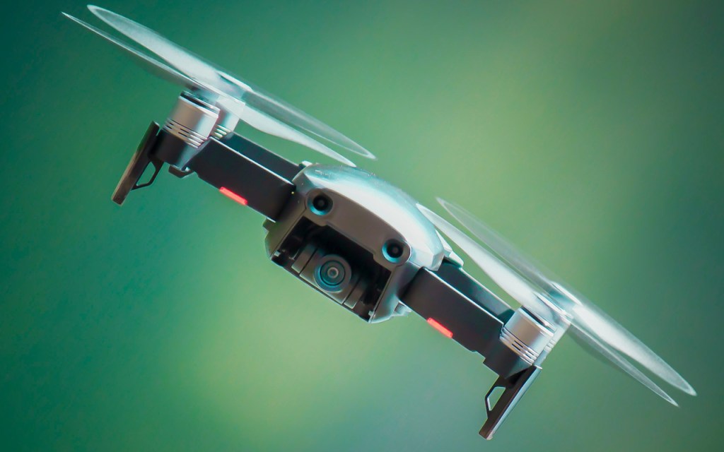 A hovering drone with its many propellers.