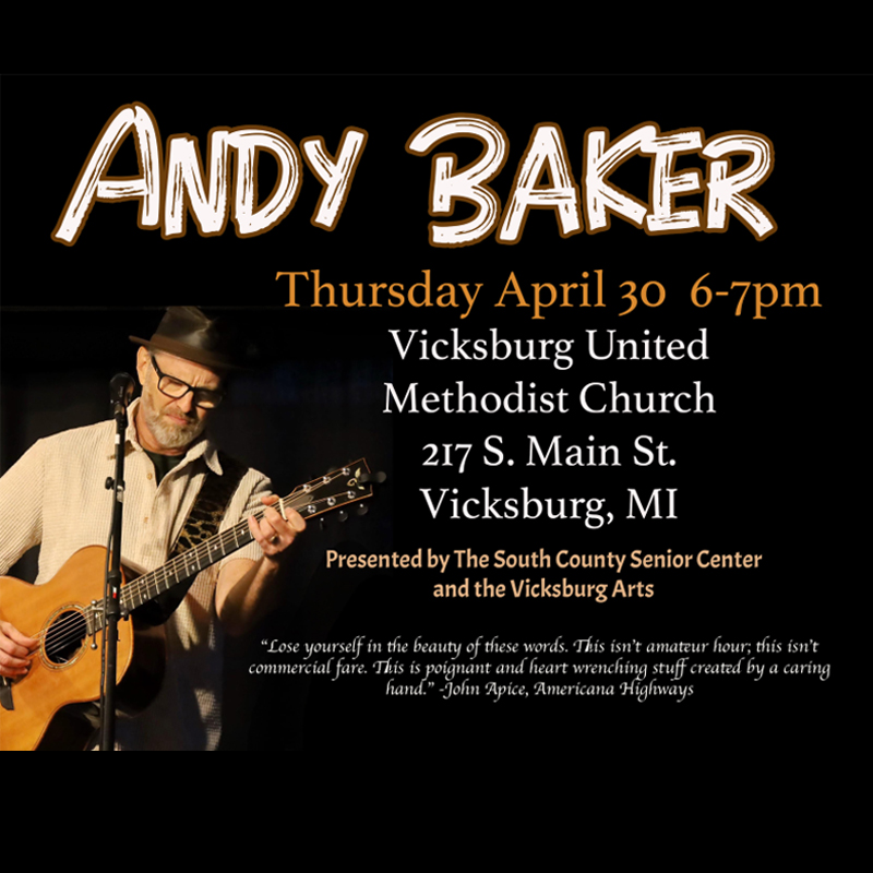 A musician with a guitar named Andy Baker.