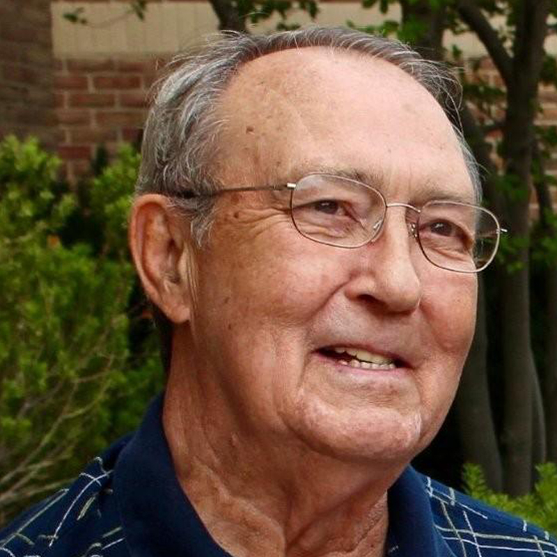 An older man with glasses.