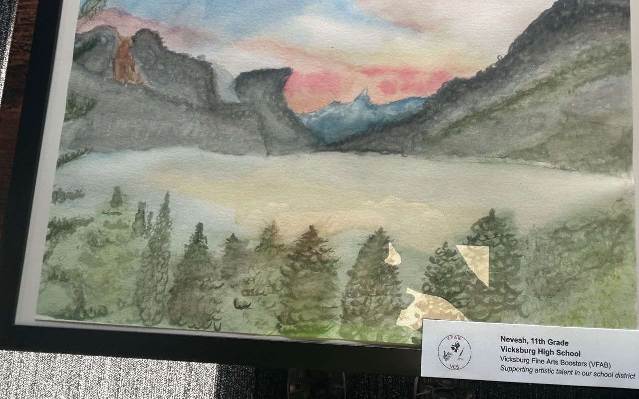 A watercolor painting of a sunset landscape.