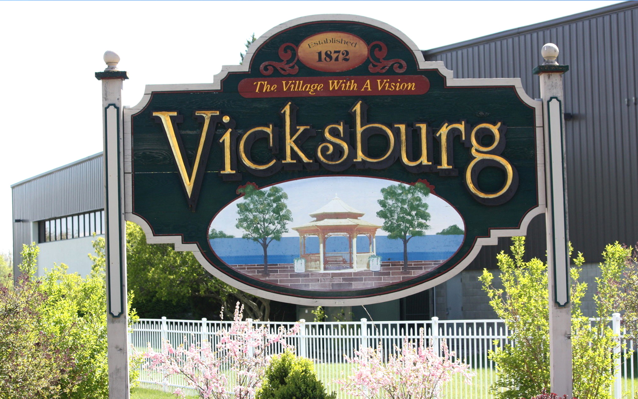 vickburgvillage A colorful sign reads "The Village with a Vision - Vicksburg."