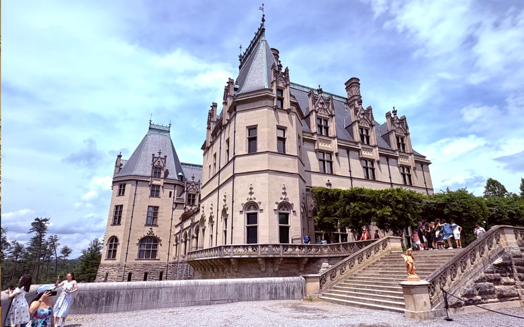 A stately gilded age mansion seen from the outside.